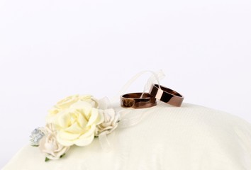 golden wedding rings - wedding ring on a silk pillow