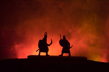 Plakat Silhouette of two samurais in duel. Picture with two samurais and sunset sky