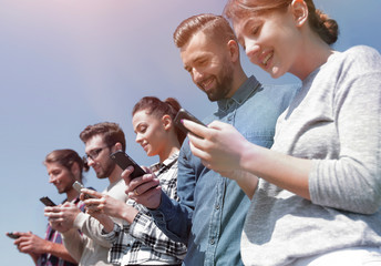 young people using smartphones to search network