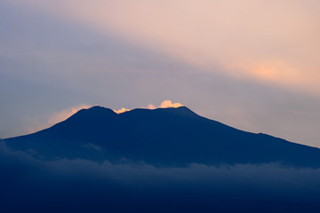 Etna volcano with clouds surrounding the mountain top