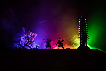 Samurai fighting concept. Silhouette of samurais in duel near tree and old temple. Picture with two...