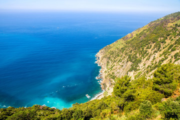 Rocks in the blue Mediterranean Sea on a bright sunny day.