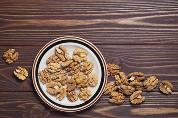 Walnut kernels on brown wooden table