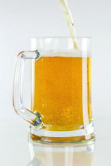 mug of beer isolated on white.