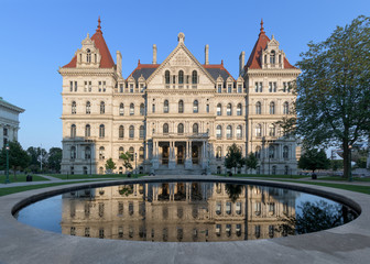 Fototapeta na wymiar New York State Capitol and its reflection from West Capitol Park in Albany, New York