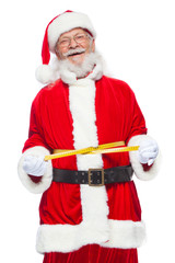 Christmas. Santa Claus is measuring waist with a tape. The concept of weight loss, healthy eating. Isolated on white background.