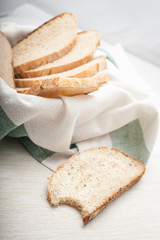 A slice of sourdough bread. Bite of a slice of a white bread.