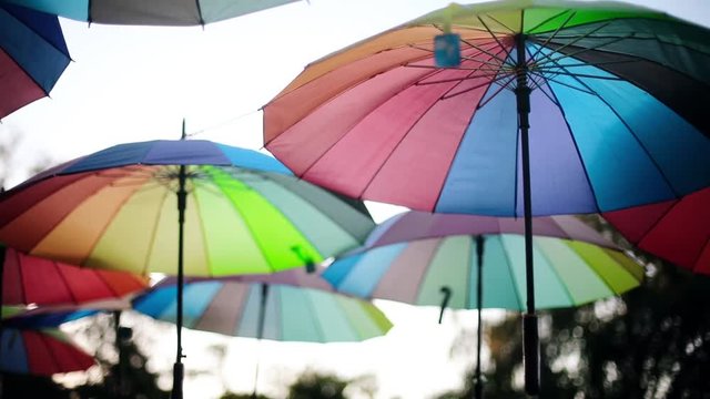 Close up footage of some multicolored umbrellas.