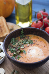 Bowl of pumpkin soup with bread. Autumn soup