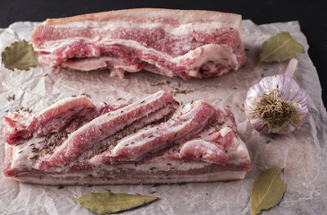 Salted pork lard with garlic and cumin. Marinated pork lard