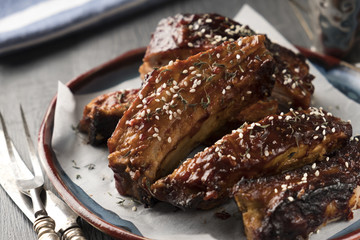 Roasted sliced barbecue pork ribs. Tasty bbq ribs on a plate
