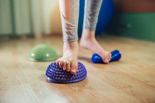 Flat Feet Correction Exercise. Little Boy Using Spiked Rubber Roller