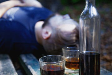 Drinking addiction, depression and dysfunctional relationship concept. Close up of man with alcohol. Drunk young people.