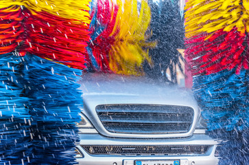 Car going through an automated car wash machine