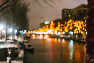 Night illumination of buildings and boats in the canal.