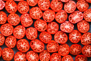 Red tomatoes slices pattern full top view