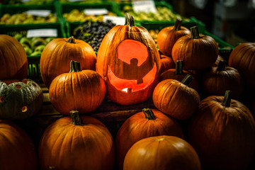 Halloween pumpkin head jack lantern on wooden background