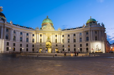 Fototapeta na wymiar Hofburg palace on St. Michael square (Michaelerplatz) at night, Vienna, Austria
