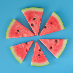 Watermelon slices on blue background