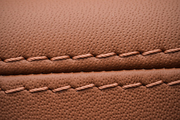 Detailed image of a car leather pleats stitch work.