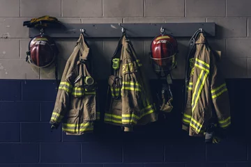 Keuken spatwand met foto Firefighter bunker suit in the fire station © Firefighter Montreal