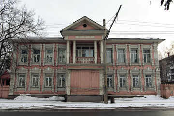 Facade of the old pink wooden house in Vologda, Russia