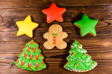 Different christmas gingerbread cookies on wooden table. Top view