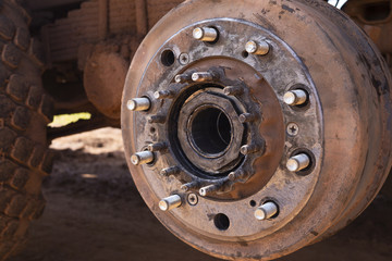 Maintenance a truck wheels hub and bearing .Rear wheels hub and bolt nut of a truck in process of changing wheel.  brake disc under repair