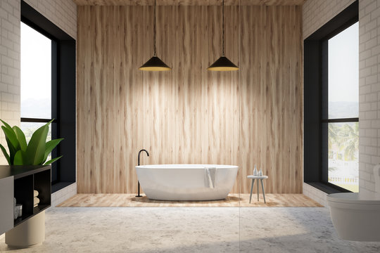Brick and wooden bathroom interior, round tub