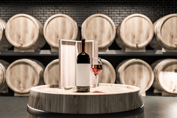 Keg with wine bottle in black brick cellar