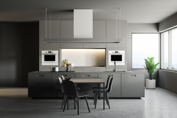Gray modern kitchen interior, table and chairs