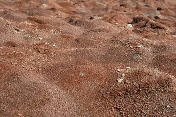 Red earth or soil background. Tropical laterite soil  background of red clay. Dry Orange surface, Picture of natural disaster. Drought land Caused by global warming and deforestation.