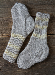 woolen socks on wooden surface