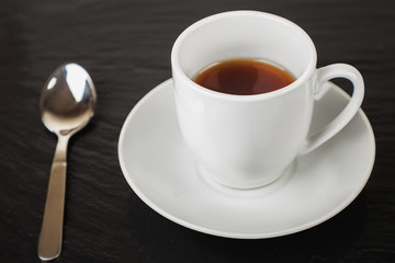 cup of coffee and teaspoon
