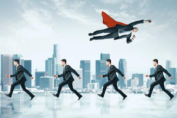 Businessman flying over crowd