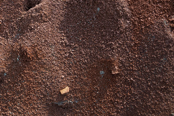 Red earth or soil background. Tropical laterite soil  background of red clay. Dry Orange surface, Picture of natural disaster. Drought land Caused by global warming and deforestation.