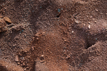 Red earth or soil background. Tropical laterite soil  background of red clay. Dry Orange surface,...