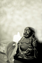 Generic buddha decoration with candle and flower