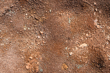 Red earth or soil background. Tropical laterite soil  background of red clay. Dry Orange surface, Picture of natural disaster. Drought land Caused by global warming and deforestation.