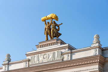The sculpture Tractor driver and collective farmer on the main entrance to the exhibition of achievements of the national economy VDNKh in Moscow