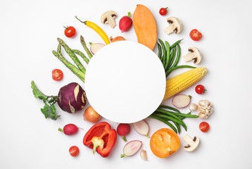 Flat lay composition with fresh vegetables and blank card for text on white background - obrazy, fototapety, plakaty