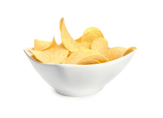 Bowl of tasty crispy potato chips on white background
