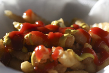 Close up of a delicious french fries portion. Cholesterol snack.