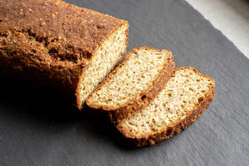 Gluten free sour dough loaf on gray slate