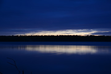 Fototapeta premium blue sunset over lake