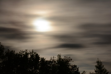 moon light shining through clouds