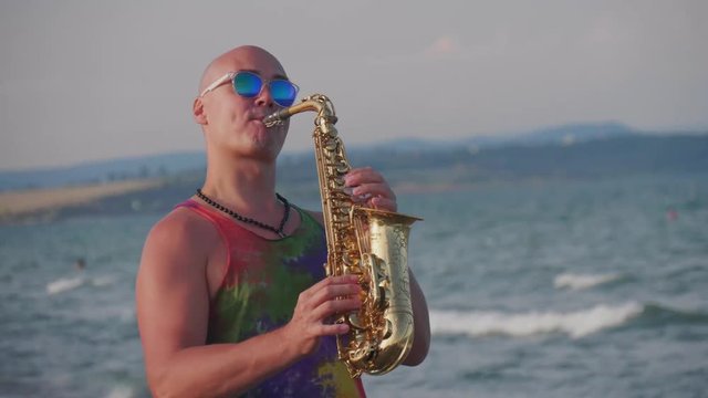 Bald Saxophone Player, Black glasses and sea