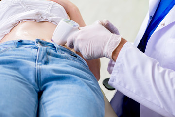 Pregnant woman visiting radiologyst for ultrasound 