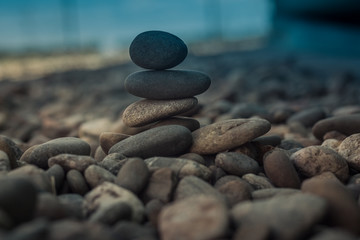 Fototapeta na wymiar Stones stacked - esoteric symbol of balance and equilibrium