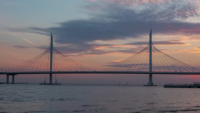 Beautiful bridge against the sunset sky. timelapse